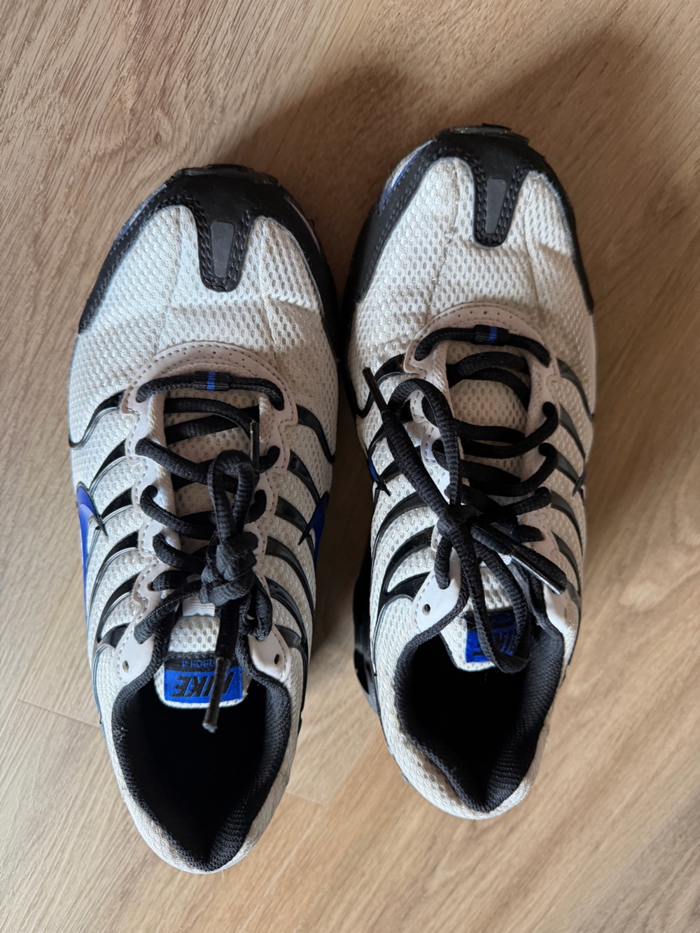Nike White and Black Athletic Shoes with Blue Accents